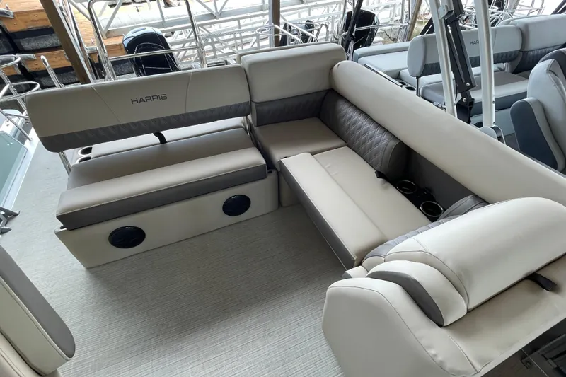 Slide: The Image of Luxurious seating on 2026 Harris Cruiser 230 pontoon boat, featuring plush upholstery and cup holders. - 23