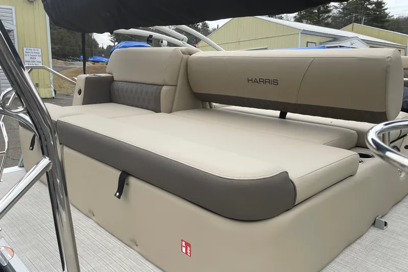 Slide: The Image of 2026 Harris Cruiser 230 boat interior with beige seating and sleek design. - 8