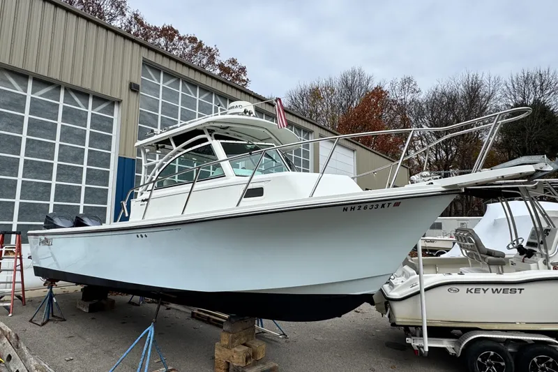 The Image of 2017 Parker 2810 XLD Walkaround boat on display outside a warehouse. - 0