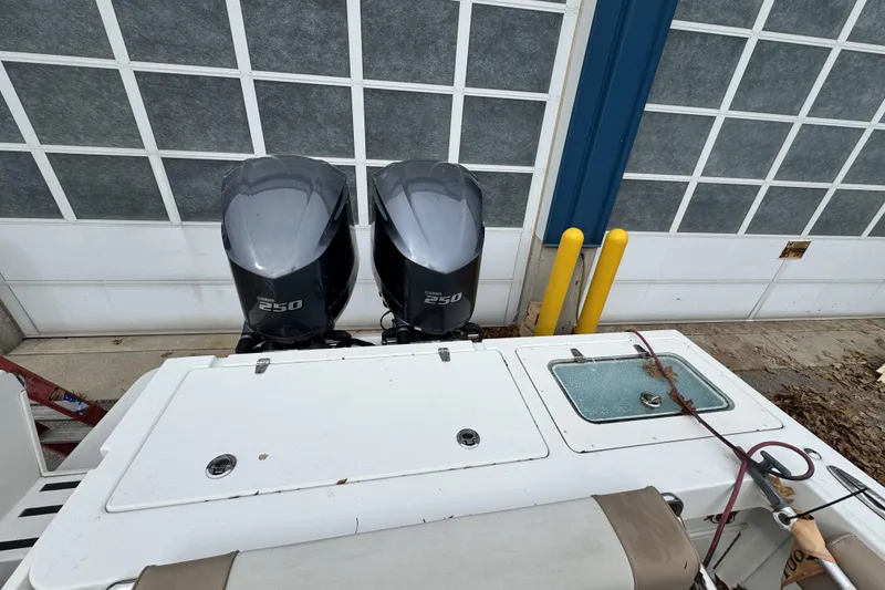 Slide: The Image of 2017 Parker 2810 XLD Walkaround boat on stands near a large building. - 5