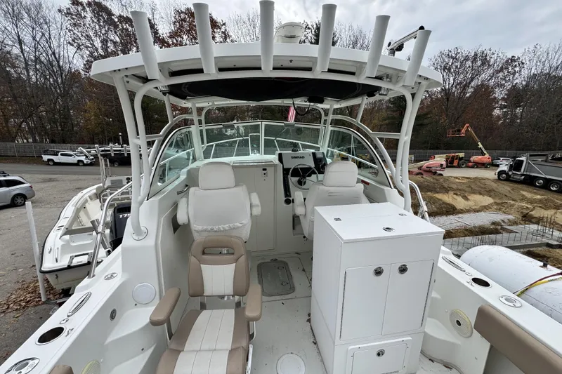 Slide: The Image of 2017 Parker 2810 XLD Walkaround boat with Yamaha engine, parked outdoors. - 6