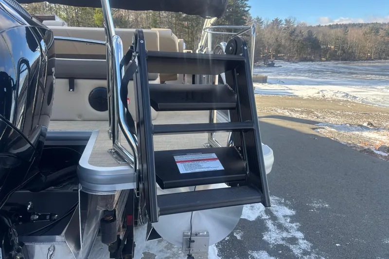Slide: The Image of 2026 Harris Cruiser 230 boat ladder on a snowy dock background. - 4