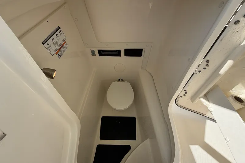 Slide: The Image of 2022 World Cat 255 DC boat interior with compact marine toilet. - 20
