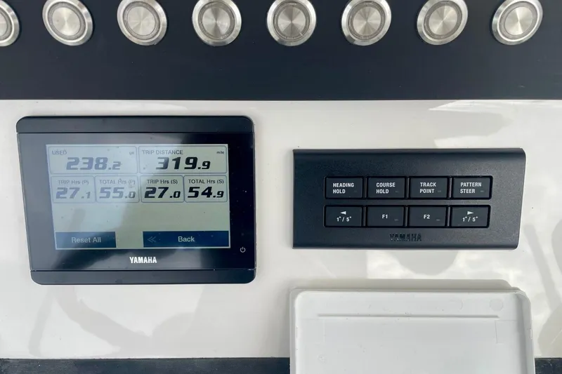 Slide: The Image of Control panel of 2023 Regulator 28 Forward Seating boat with Yamaha display and buttons. - 23