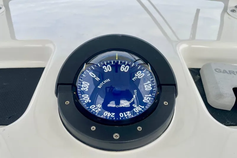 Slide: The Image of Compass on 2023 Regulator 28 Forward Seating boat dashboard. - 27