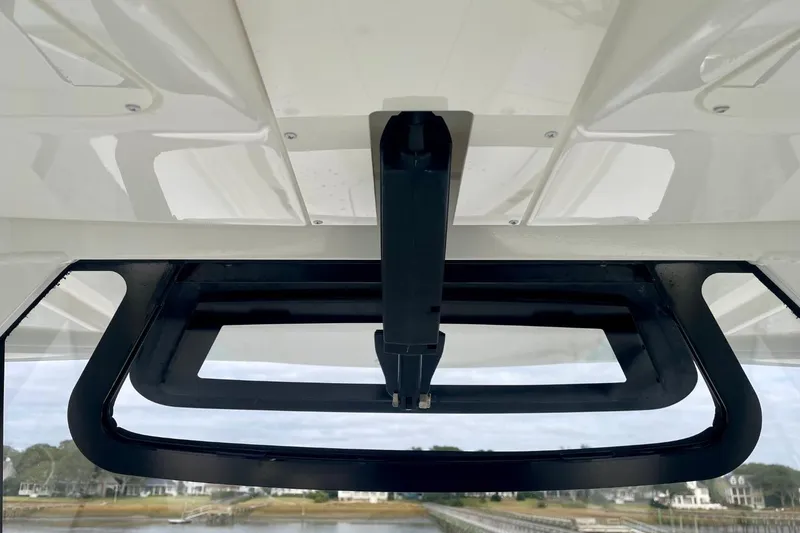 Slide: The Image of 2023 Regulator 28 Forward Seating boat hatch detail with scenic background. - 29