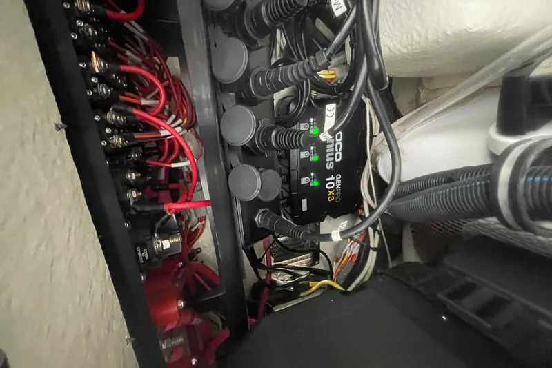 Slide: The Image of Electrical wiring and components inside a 2023 Regulator 28 Forward Seating boat. - 31
