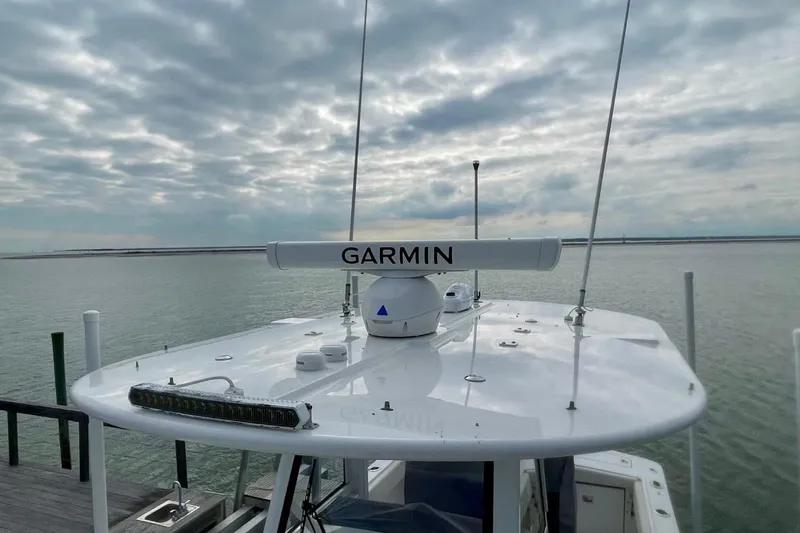 Slide: The Image of 2023 Regulator 28 Forward Seating boat with Garmin radar on calm water. - 5