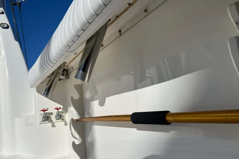 Slide: The Image of 2003 Henriques Yachts 35 Sportfisherman interior detail with rod holders and controls. - 12