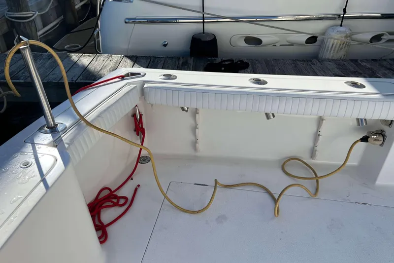 Slide: The Image of 2003 Henriques Yachts 35 Sportfisherman deck with cables and dock view. - 15