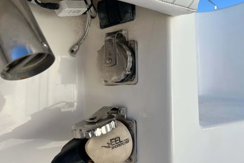 Slide: The Image of 2003 Henriques Yachts 35 Sportfisherman shore power connections and fittings detail. - 17