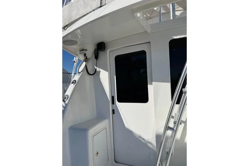 Slide: The Image of 2003 Henriques Yachts 35 Sportfisherman, exterior view with door and ladder. - 20