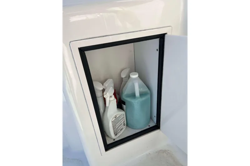 Slide: The Image of Storage compartment on 2003 Henriques Yachts 35 Sportfisherman with cleaning supplies. - 22