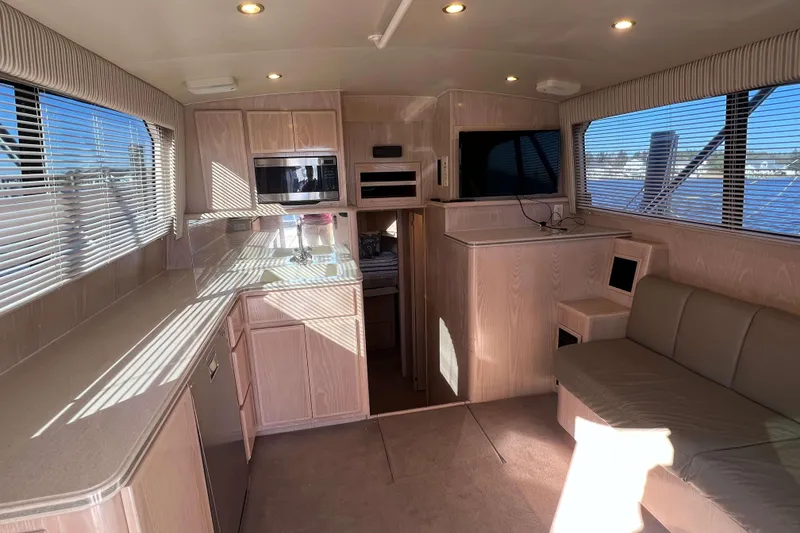 Slide: The Image of Interior of 2003 Henriques Yachts 35 Sportfisherman with modern kitchen and seating area. - 23