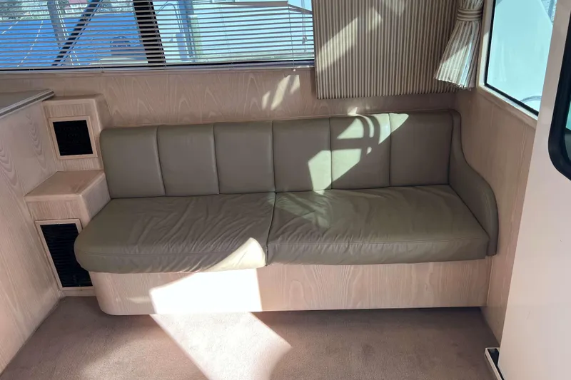 Slide: The Image of Interior of 2003 Henriques Yachts 35 Sportfisherman with beige leather seating and wood paneling. - 34