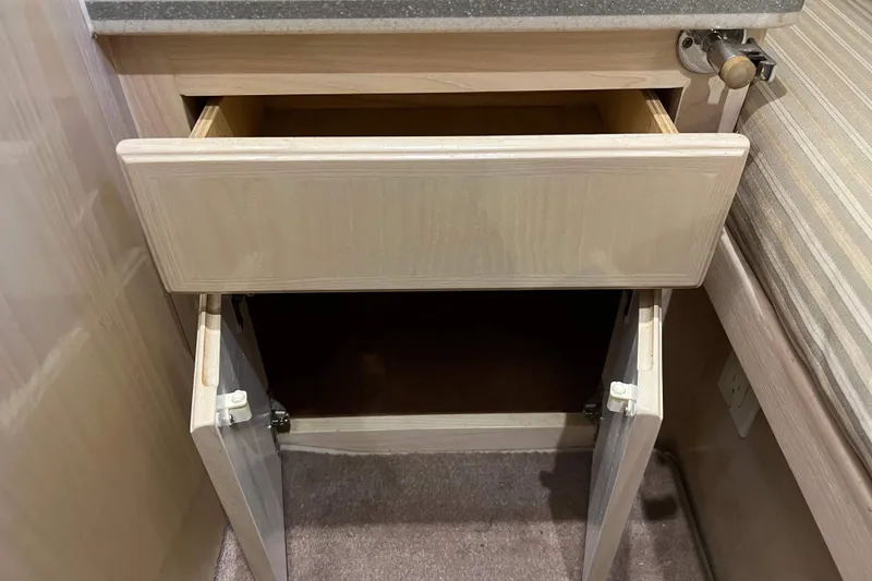 Slide: The Image of Open drawer and cabinet in 2003 Henriques Yachts 35 Sportfisherman interior. - 41