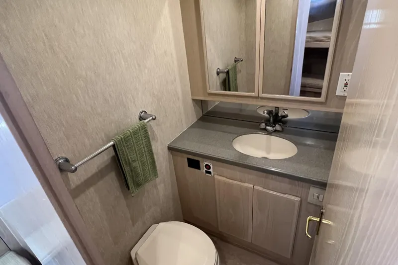 Slide: The Image of Bathroom interior of 2003 Henriques Yachts 35 Sportfisherman with sink, mirror, and towel rack. - 42