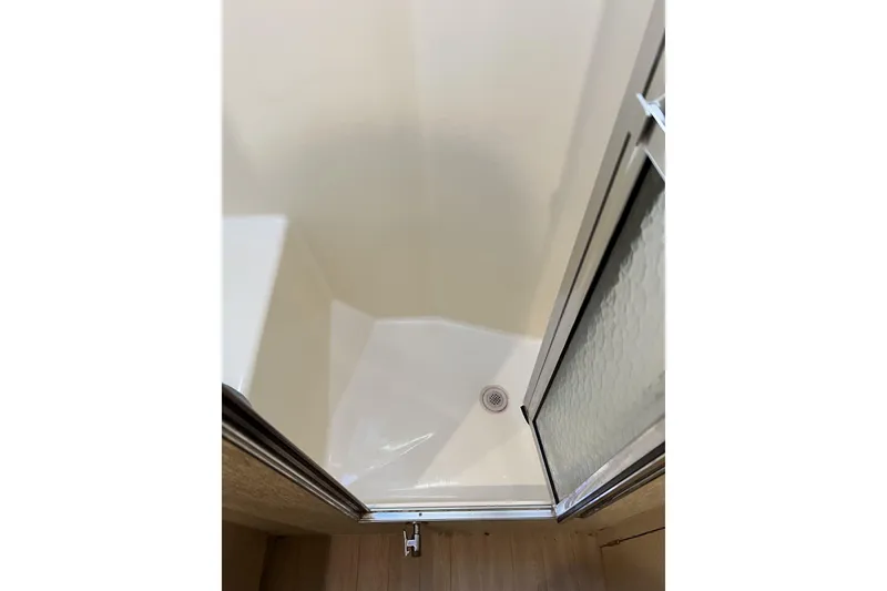 Slide: The Image of Shower area inside 2003 Henriques Yachts 35 Sportfisherman, featuring a sliding door. - 48