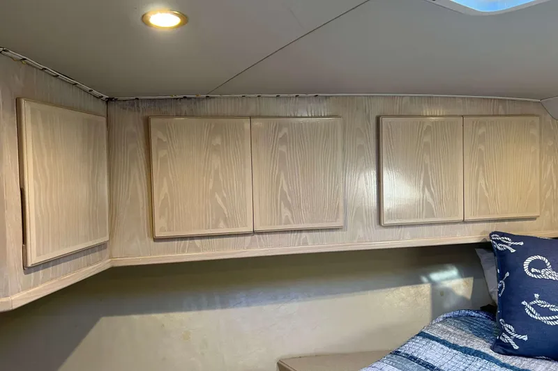 Slide: The Image of Interior cabin of 2003 Henriques Yachts 35 Sportfisherman with wooden cabinets and nautical decor. - 50