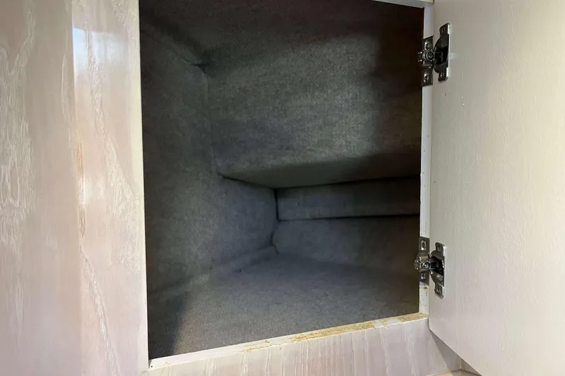 Slide: The Image of Empty storage compartment inside a 2003 Henriques Yachts 35 Sportfisherman. - 51