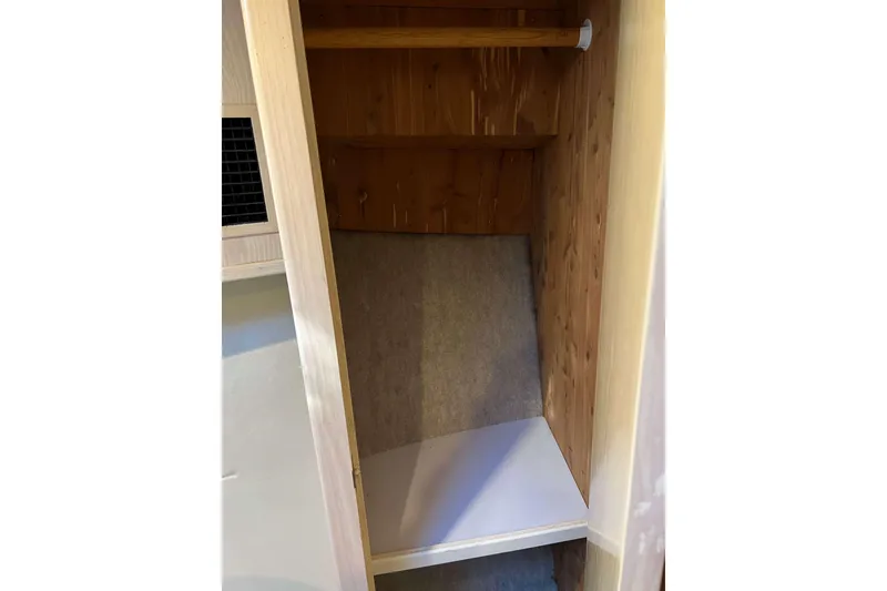 Slide: The Image of Wooden storage closet inside 2003 Henriques Yachts 35 Sportfisherman. - 54