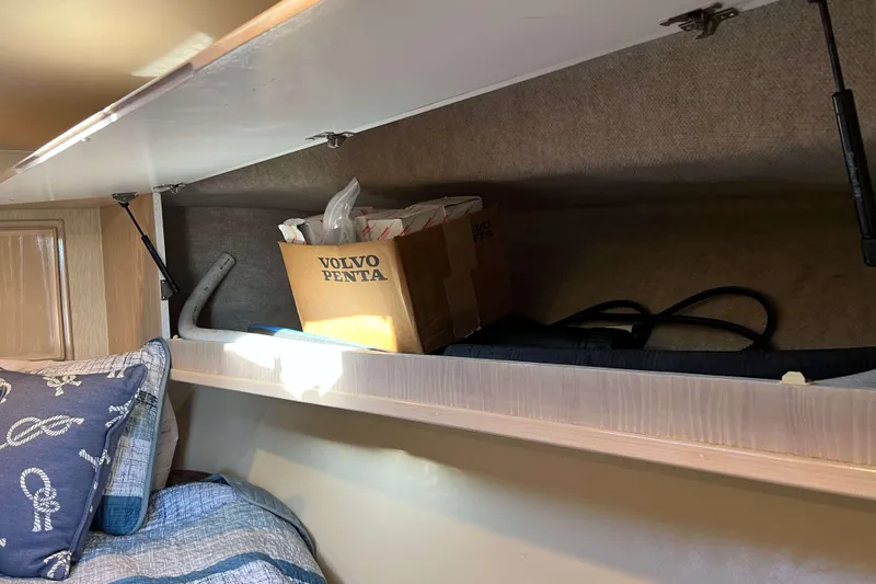 Slide: The Image of Storage compartment in 2003 Henriques Yachts 35 Sportfisherman with Volvo Penta box and nautical decor. - 56