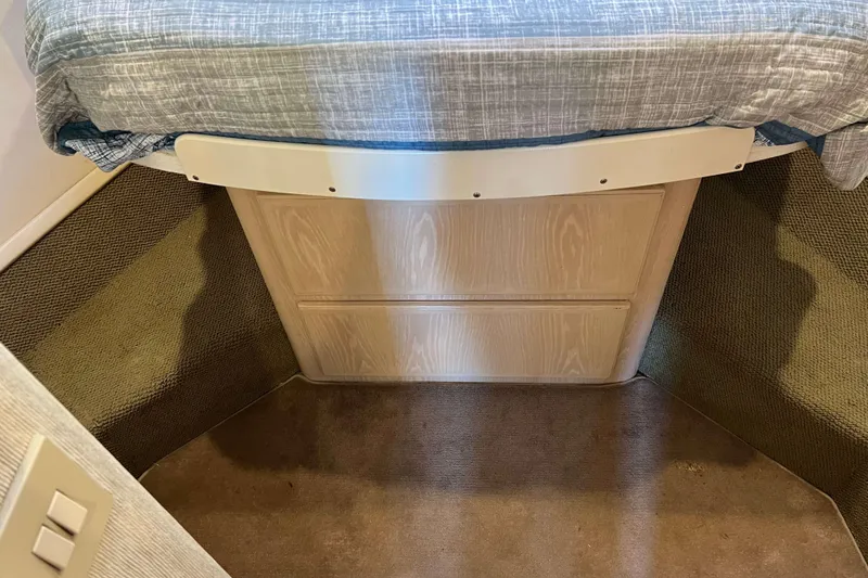 Slide: The Image of 2003 Henriques Yachts 35 Sportfisherman cabin interior with bed and carpeted floor. - 57