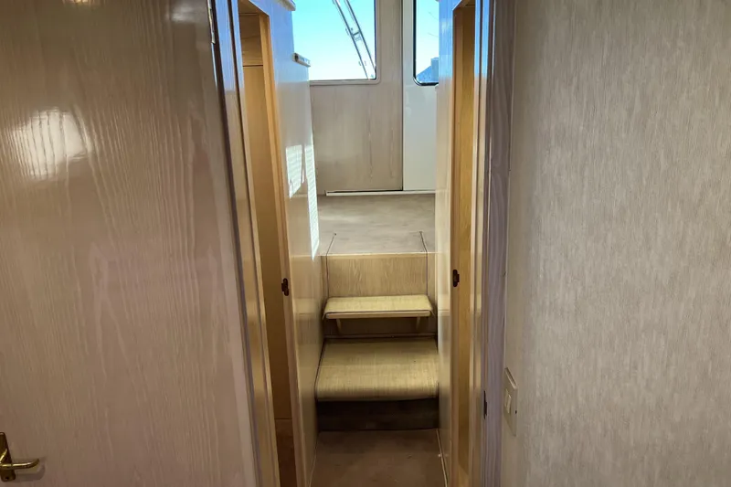 Slide: The Image of Interior hallway of 2003 Henriques Yachts 35 Sportfisherman with wooden finish and steps. - 61