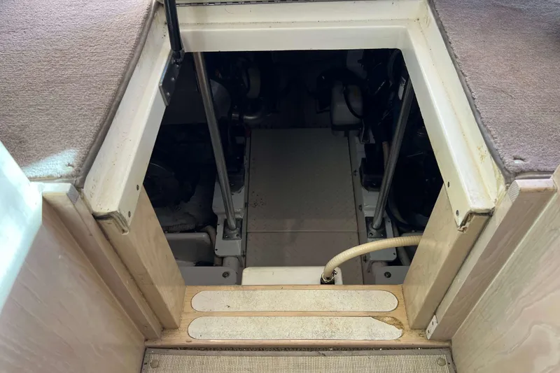 Slide: The Image of Engine compartment of 2003 Henriques Yachts 35 Sportfisherman, showing interior access and components. - 63