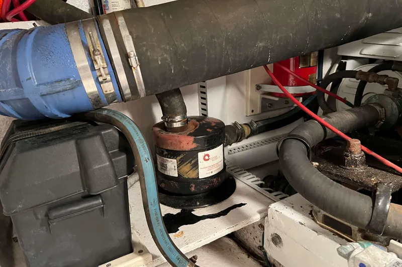 Slide: The Image of Engine room of 2003 Henriques Yachts 35 Sportfisherman with hoses and components. - 67