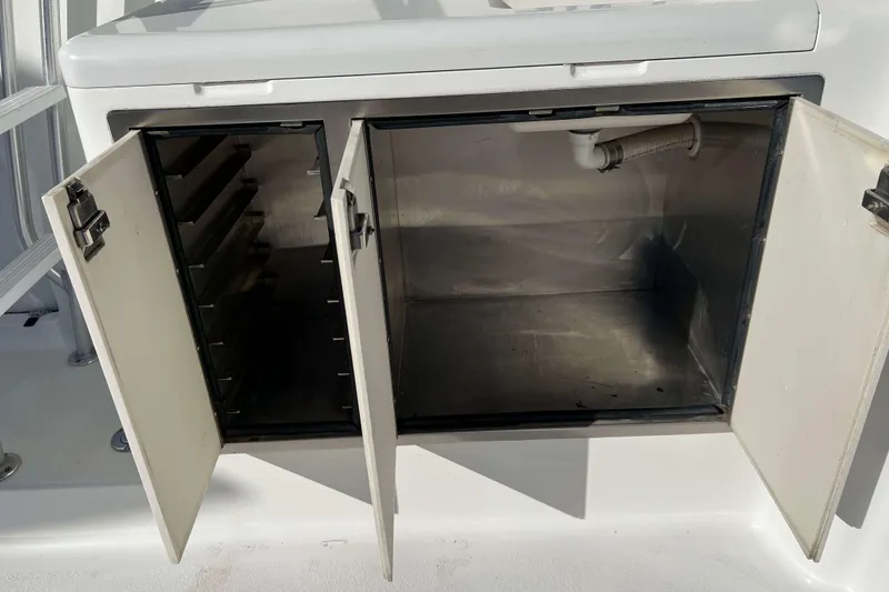 Slide: The Image of Open storage compartments on a 2003 Henriques Yachts 35 Sportfisherman boat. - 7