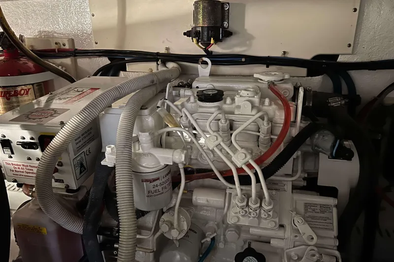 Slide: The Image of Engine room of a 2003 Henriques Yachts 35 Sportfisherman, showcasing mechanical components. - 72