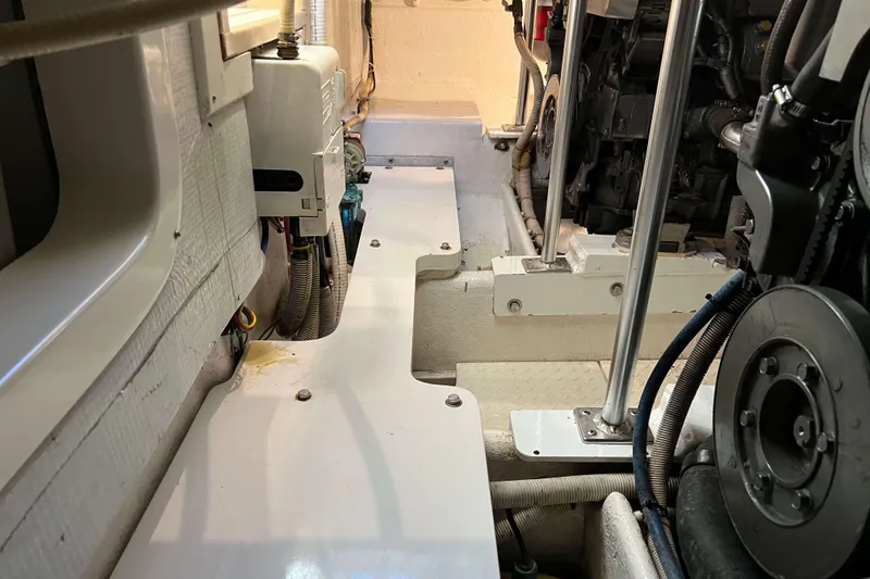 Slide: The Image of Engine room of 2003 Henriques Yachts 35 Sportfisherman, showcasing mechanical components. - 77