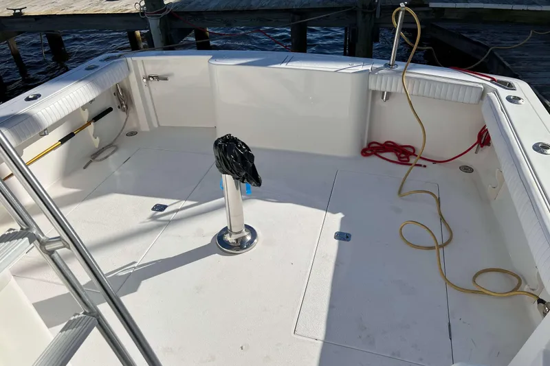 Slide: The Image of 2003 Henriques Yachts 35 Sportfisherman deck with fishing gear and ropes. - 80