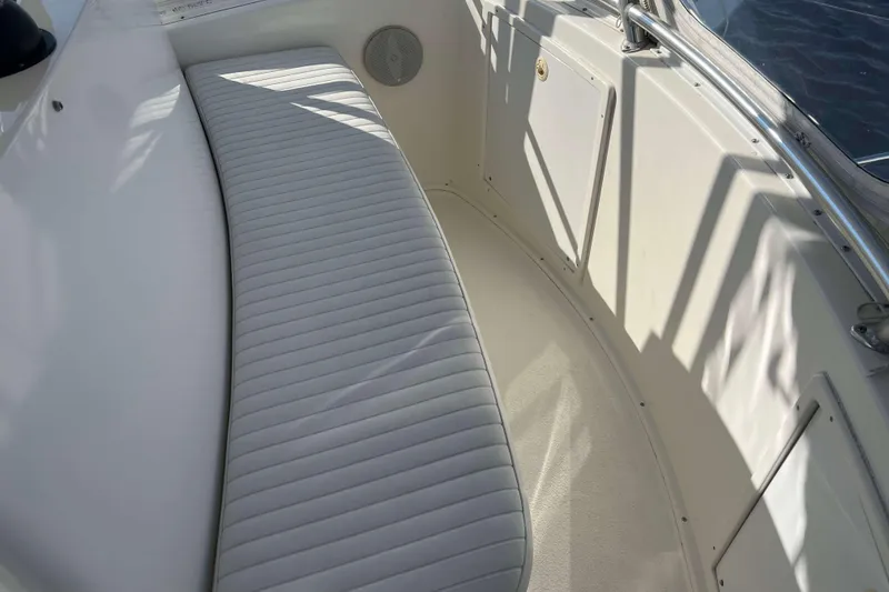 Slide: The Image of 2003 Henriques Yachts 35 Sportfisherman interior with white cushioned seating. - 92