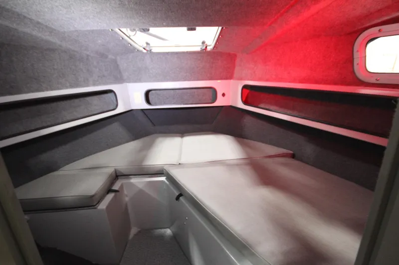 Slide: The Image of Interior cabin of 2025 Weldcraft 300 Cuddy King OS, featuring cozy sleeping area. - 37