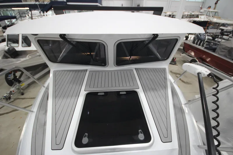 Slide: The Image of 2025 Weldcraft 300 Cuddy King OS boat deck with custom design and trailer. - 47
