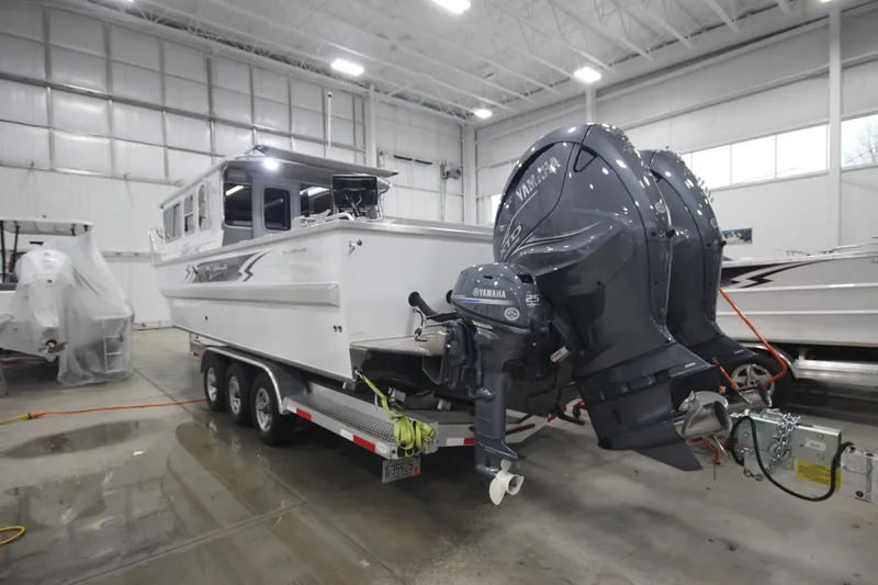 Slide: The Image of 2025 Weldcraft 300 Cuddy King OS with twin Yamaha 425 engines on custom trailer. - 5