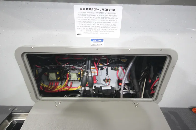 Slide: The Image of Electrical compartment of 2025 Weldcraft 300 Cuddy King OS, showcasing wiring and components. - 13