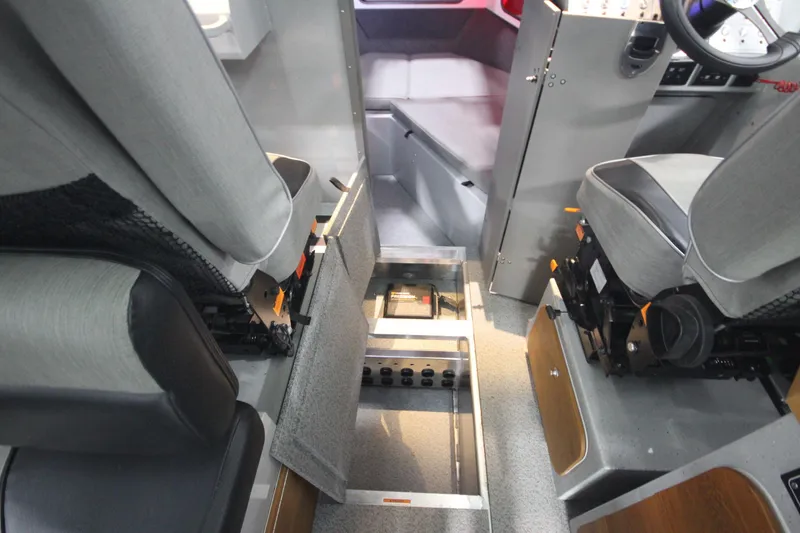 Slide: The Image of Interior view of 2025 Weldcraft 300 Cuddy King OS, showcasing seating and storage. - 34