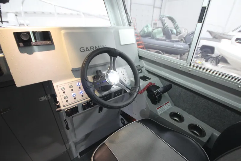 Slide: The Image of 2025 Weldcraft 300 Cuddy King OS helm with Garmin system and controls. - 36