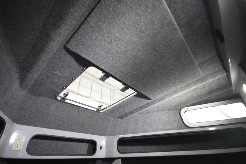 Slide: The Image of Interior view of 2025 Weldcraft 300 Cuddy King OS cabin ceiling with hatch and windows. - 41