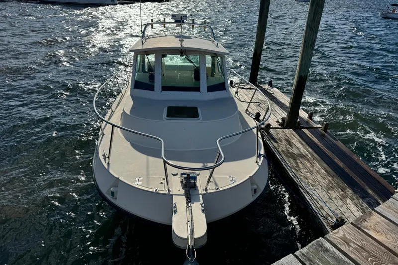 The Image of 1999 Albin 28 Tournament Express boat docked on a sunny day. - 1