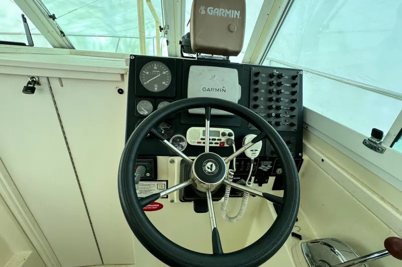 Slide: The Image of 1999 Albin 28 Tournament Express helm with Garmin navigation system and control panel. - 10