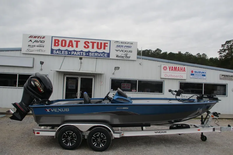 The Image of 2026 Vexus AVX1985S boat on trailer outside dealership, featuring Yamaha outboard motor. - 0