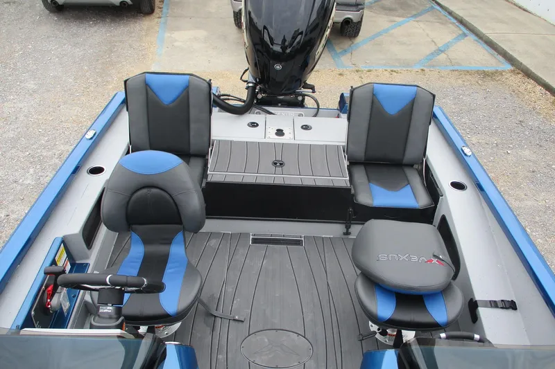 Slide: The Image of 2026 Vexus AVX1985S boat interior with blue and black seating, modern design. - 11