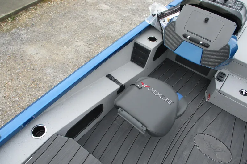 Slide: The Image of 2026 Vexus AVX1985S boat interior with seating and control panel, featuring sleek design elements. - 14