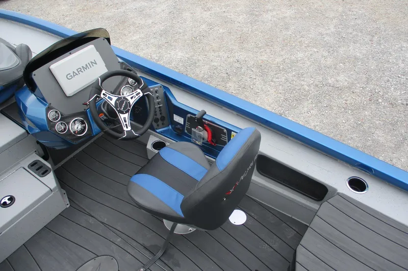 Slide: The Image of 2026 Vexus AVX1985S boat cockpit with Garmin navigation and blue-accented seating. - 18