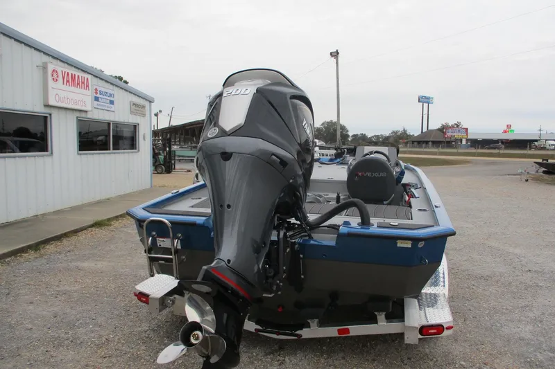 Slide: The Image of 2026 Vexus AVX1985S boat with Yamaha outboard motor at dealership. - 4