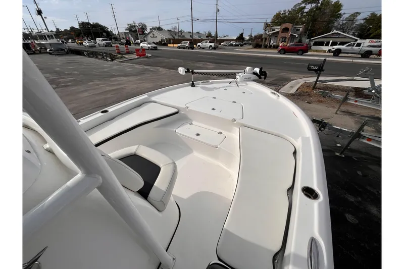 Slide: The Image of 2023 Tidewater 2210 Carolina Bay boat interior with seating and storage compartments. - 10